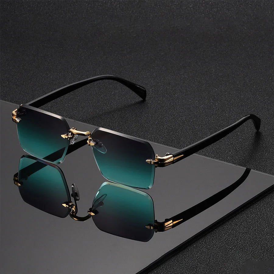Okulary przeciwsłoneczne damskie rimless z gradientowymi soczewkami i złotym mostkiem na ciemnym tle