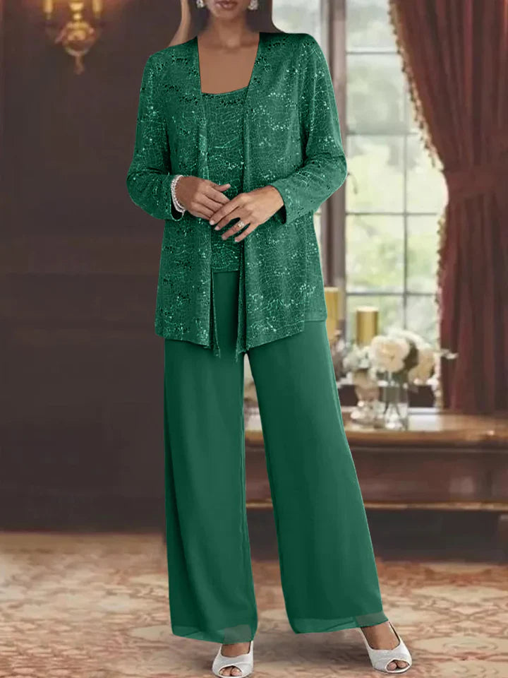 Elegancki komplet damski z połyskującą narzutką i szerokim krojem spodni w jednolitym kolorze