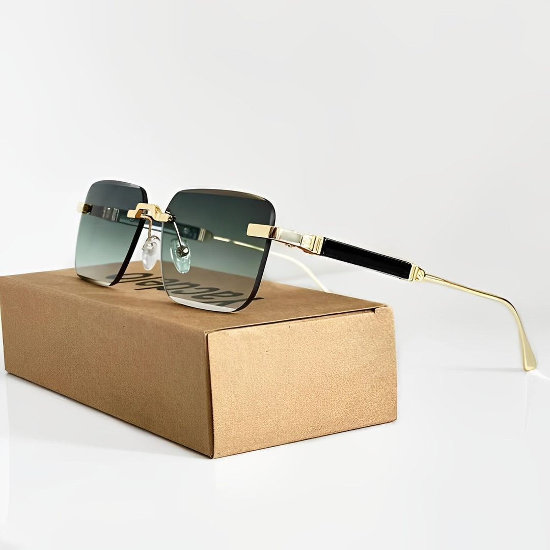 Okulary przeciwsłoneczne damskie w stylu retro ze złotymi oprawkami i gradientowymi szkłami ułożone na kartonowym pudełku